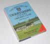 ‘The History of Derbyshire County Cricket Club’. John Shawcroft. Christopher Helm, Bromley 1989. Hardback with dustwrapper. Profusely signed with over two hundred and eighty signatures to the pages, inside covers, endpapers, title pages and throughout by 