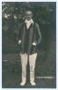 Alfred Herbert Harold Gilligan. Sussex & England 1919-1931. Mono real photograph postcard of Gilligan standing full length wearing cricket attire and striped blazer. Signed in ink to the photograph by Gilligan. Blind embossed stamp for Nias of Brighton. P