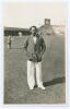 Kumar Shri Duleepsinhji. Sussex, Cambridge University & England 1924-1932. Original mono real photograph postcard of Duleepsinhji standing full length on the outfield at Scarborough, wearing cricket attire and striped blazer. Official stamp to verso for W