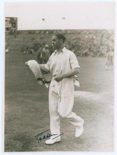 George Oswald Browning ‘Gubby’ Allen. Middlesex, Cambridge University & England 1921-1950. Original mono photograph of Allen, full length on the outfield at Scarborough, wearing cricket attire and holding a sweater. Annotation in pencil to verso indicates