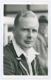 George Rammell Taylor. Hampshire 1935-1939. Mono real photograph plain back postcard of Taylor, head and shoulders wearing cricket attire and blazer. Official stamp to verso for A. Wilkes & Son, West Bromwich, and dated 1939. Good/ very good condition.