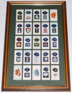 W.A. & A.C. Churchman ‘Famous Cricket Colours’ 1928. Full set of twenty five cigarette cards window mounted, framed and glazed. Very good condition. Sold with two original scorebooks, one with scores for wartime matches played at Lord’s 1944 and 1945. Mat