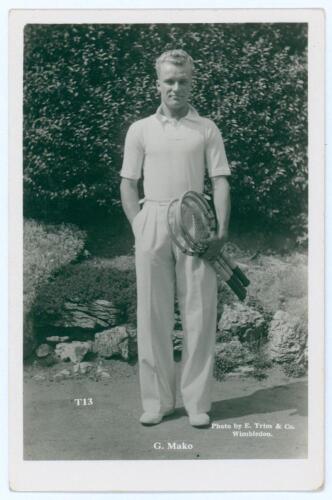 Constantine &lsquo;Gene&rsquo; Mako. Original mono real photograph postcard of Mako, standing full length, wearing tennis attire and holding two rackets to his side. Players name printed to lower border. Card no. T13 in a series issued by Edwin Trim & Co. of Wimbledo