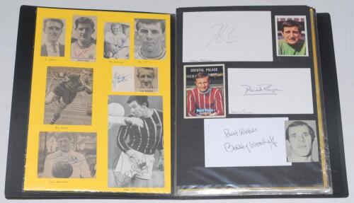 Football autographs 1950s-2000s. Four black files comprising well over 450 signatures of England Football League players and some non-League and European clubs. Signatures are to laid down magazine pages, cuttings, white cards, trade cards, pages, program