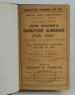 Wisden Cricketers’ Almanack 1897. 34th edition. Bound in dark brown boards, with original front paper wrapper lacking rear, with title and date in gilt to spine, beautifully marbled page block edge. Minor wear to wrappers, oval book seller stamp to front 