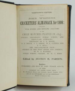 Wisden Cricketers’ Almanack 1898. 35th edition. Handsomely bound in full black leather, lacking original paper wrappers, with raised bands and title and date in gilt to spine. Lacking front and rear advertising pages otherwise in good/very good condition.