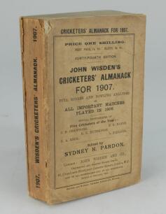 Wisden Cricketers’ Almanack 1907. 44th edition. Original paper wrappers. Some age toning to wrappers and spine paper, small loss to the top left hand corner of the front wrapper, some breaking to spine block, some wear and loss to spine paper, breaking to