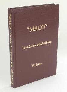 ‘Maco. The Malcolm Marshall Story’. Pat Symes 2000. Limited edition number 81 of 100 copies published. Signed by Symes. Various press cuttings laid down to the inside of boards and end papers. Name of ownership and date handwritten to the inside of the fr