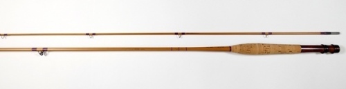 A J.K. Wheeldon "T.M. 02" 2 piece cane brook trout fly rod, 7'6", #4, crimson silk wraps, walnut reel seat with sliding bronzed fittings, suction joint, light use, in bag