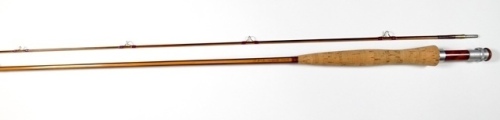 A P.J. Budde "Black Phantom" 2 piece cane brook trout fly rod, 7', #4/5, two tone stripped cane construction, scarlet silk wraps, olivewood reel seat and butt cap with alloy screw grip fitting, suction joint, little used condition, in bag