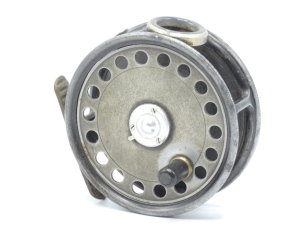 A Hardy St George 3 3/8" trout fly reel, shallow cored drum with ebonite handle and three screw latch, ribbed brass foot, white agate line guide (no cracks), milled rim tension screw and Mk.II check mechanism, interior stamped "J.S." (Jimmy Smith), wear t