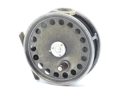 A Hardy St George 3 ¾" trout fly reel, shallow cored drum with ebonite handle and three screw spring latch, brass foot, white agate line guide (two fine hairline cracks), milled rim tension screw and Mk.II check mechanism, light wear from normal use, 192