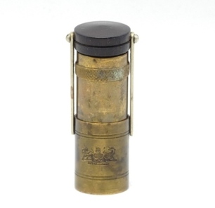 A rare Hardy Zephyr brass pocket oil bottle, the cylindrical shaped container with retractable inner reservoir, turned rosewood cap and cork stopper mounted on two nickel silver hinged arms, lower receiver stamped maker's details and Royal Coat of Arms, c