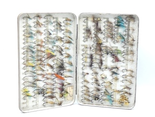 A scarce Hardy japanned sea-trout/low water salmon fly box, the rectangular case fitted 200 nickel silver spring fly clips and holding a good selection of mainly low water salmon flies, lid with applied oval nickel silver trade plaque, later brown painte