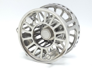 A rare Hardy Zane No.3 Titanium prototype saltwater fly reel, large arbour skeletal drum with counter-balanced handle and milled spool locking nut, pierced foot on twin stancheon supports, open cage and backplate with twin bar supports and central milled 