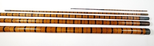 A good five piece whole bamboo roach pole, 17'6", black silk inter-whippings, brass ferrules and stopper caps, in bag, circa 1900