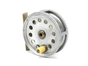 A Percy Wadham Test 3 1/8" trout fly reel, ivorine handle, brass foot, hollow brass spindle with rear tension nut, backplate stamped makers details, used condition, circa 1920