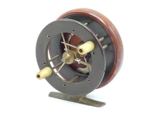 A rare Coxon Aerial 4104-T3 three spoke 3" wide drummed centre pin reel, caged three spoke drum with twin tapered horn handles, ebonite flanges, front flanged stamped 'patent' and single release fork, mahogany backplate with brass starback stancheon foot 