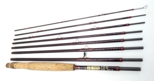 A Hardy "Smuggler Deluxe" 8 piece carbon valise trout fly rod and leather tube, 9'5", #7, crimson/scarlet tipped wraps, anodised sliding reel fitting, spigot joints, in bag and leather tube