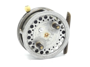 A Hardy Super Silex 3 ¾" bait casting reel, shallow cored drum with twin ebonite handles, jewelled spindle bearing and sporing release latch, ribbed brass foot, ivorine rim casting trigger, milled regulator screw and rear ivorine quadrant weight indicato