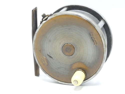 A scarce Hardy Brass Faced Perfect 4 ¼" salmon fly reel, domed ivorine handle, pierced brass foot, strapped rim tension screw with Turk's head locking nut and early calliper spring check mechanism, solid drum (no perforations) with milled nickel silver lo