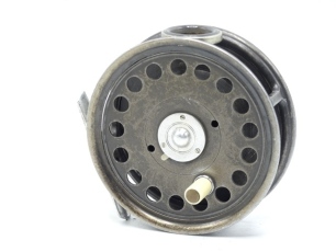 A scarce Hardy St George 3 ¾" trout fly reel, shallow cored drum with ivorine handle and three screw spring latch, white agate line guide (ne fine hairline crack), alloy foot, milled nickel silver rim tension screw and Mk.I check mechanism, only light us