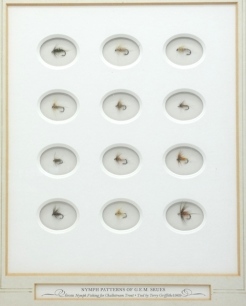 Nymph Patterns of G.E.M. Skues, framed display of twelve various trout nymphs, tied by Terry Griffiths, each displayed within a circular recessed mount, with title plate to lower section, dated 1969, within a glazed, stepped oak frame and another frame 