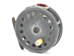 A rare and unusual Hardy St. George 3 ¾" 1st model trout fly reel, drum with ventilated shallow core, ivorine handle and split brass knurled locking nut, brass foot, red agate line guide (no cracks), strapped rim tension screw and second variation Mk.I c