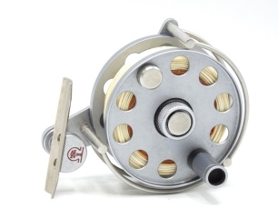 An Ari't Hart AR II trout fly reel, graphite anodised right hand wind model with counter-balanced handle milled drum locking nut, off-set triform foot, three quarter annular line guide and rear spindle tension adjuster, light use only (see illustration)