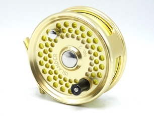 An Islander No.2 bonefish fly reel, gold anodised finish left hand wind model with counter-balanced composition handle, block foot and rear spindle mounted tension adjuster, only very light use, in original neoprene pouch