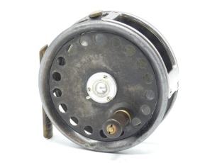 A rare Hardy Barton 3 ¼" trout fly reel, reverse tapered ebonite handle, off-set ribbed brass foot, three screw spring drum latch, rectangular nickel silver line guide, rim mounted milled tension regulator and Mk.II check mechanism, faceplate neatly bloc