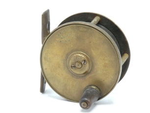 A Hardy Birmingham brass 2 ½" trout fly reel, horn handle, pierced and waisted bridge foot, triple cage pillars, fixed check mechanism, faceplate stamped open oval logo, wear to finish from normal use, circa 1895