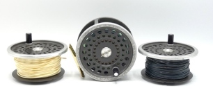 A Hardy Marquis Salmon No.3 salmon fly reel and two spare spools, composition handle, ribbed brass foot, two screw drum latch, rear tension adjuster, in zip case, spools in card boxes, wear from normal use