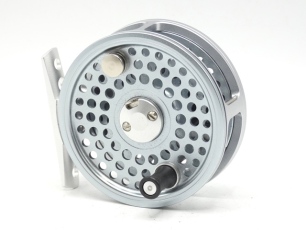 A Young's Jubilee 5100 trout fly reel, silver graphite anodised finish, counter-balanced handle, two spring drum latch and rear tension adjuster, as new in box and bag and a Sage "389 LL" 2 piece carbon trout fly rod, 8'9", #3, wooden reel seat, screw gr