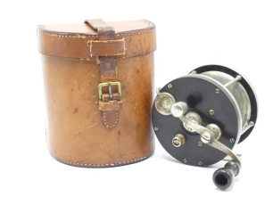 An Edward Vom Hofe Universal Special 6/0 model 501 big game reel and block leather case, ebonite and nickel silver construction with off-set serpentine crank winding arm, twin rim mounted casting controls, pierced foot, stamped model details and date sta