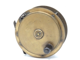 An Army & Navy 5" brass Hercules style salmon fly reel, domed cow horn handle on raised faceplate, pierced and waisted bridge foot, quadruple cage pillars, strapped rim tension screw, faceplate script engraved retailer's details and with raised two screw