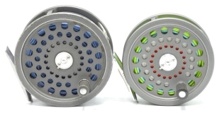 A Hardy JLH Salmon fly reel, grey anodised finish, composition handle, two screw drum latch, alloy foot, rear spindle mounted milled tension regulator, wear from normal use and a similar Hardy JLH Ultralite 8/9 sea-trout fly reel (2)