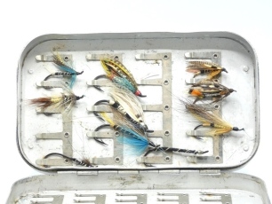 Ten eyed salmon flies, three tied by Megan Boyd, contained within a Wheatley alloy fly box and formerly the property of the late Richard Slocock, a founder of the Wild Trout Trust, the flies are sold with a letter of provenance from R.S. signed and dated 