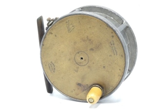 A Hardy Brass Faced Perfect 4 ¾" salmon fly reel, domed ivorine handle, brass foot, strapped rim tension screw with Turk's head locking nut and 1906 calliper spring check mechanism, slightly dished drum with four rim cusps and milled nickel silver lockin