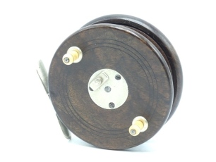 A fine Brailsford style 4" Nottingham centre pin reel, walnut drum with turned baluster bone handles and nickel silver slipper type three screw spring latch, nickel silver cruciform foot with fleur de Lys finials and sliding rectangular optional check bu