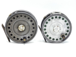 A Hardy St. George 3 ¾" trout fly reel, unleaded drum with ebonite handle and three screw latch, brass foot, white metal line guide, rim tension screw and Mk.II check mechanism, 1940's and a Hardy St. John 3 ?" light salmon fly reel of similar design, 193