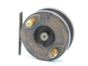 A scarce Kenton's Patent Cone 3" centre pin reel, solid walnut drum with twin cow horn handles, recessed spindle well and milled brass tension nut, nickel silver backplate with brass starback foot, stamped model details and sliding optional check button w