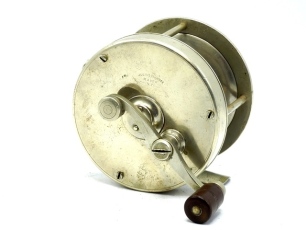 A scarce Julius Vom Hofe German silver 3 ½" multiplier reel, solid nickel silver construction with 2:1 ratio half bridged gearing, off-set serpentine ebonite crank handle, block foot stamped 2/00, rim mounted drum tension button, hinged spindle oil caps 