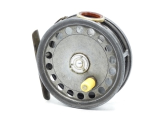 A scarce Hardy St George 2nd model 3 ¾" trout fly reel, shallow cored drum with ivorine handle, vented arbour and three screw spring latch, brass foot, red agate line guide (no cracks), brass strapped rim tension screw and bar spring check mechanism, back