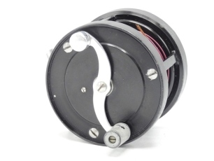 An S. E. Bogdan model 300 multiplying salmon fly reel, right hand wind, black anodised model with 2:1 ratio gearing, counter-balanced "S" scroll handle set within an anti-foul rim, block foot, stamped model details, rear milled optional check button and o