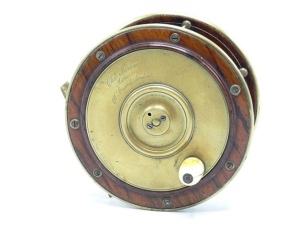 A Chas. Farlow 5 ¼" Perth style rosewood salmon fly reel, domed bone handle on brass winding plate, bridge foot, brass bound rims, five pillared cage, fixed check mechanism, faceplate with raised two screw spindle boss, script engraved retailer's details