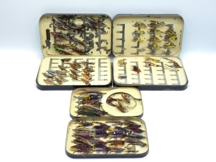 A Farlow black japanned salmon fly box, cream painted interior fitted swing leaf and holding 44 fully dressed salmon flies including 10 gut eyed examples, a similar Malloch fly box holding 46 fully dressed eyed salmon irons and another Malloch fly box hol