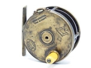 A rare Hardy 1896 Brass Perfect Houghton Dry Fly 2 5/8" wide drummed trout fly reel, domed ivorine handle, block foot pierced seven holes, strapped rim tension screw and early calliper spring check mechanism, pen ball race with phosphor bronze bearings,