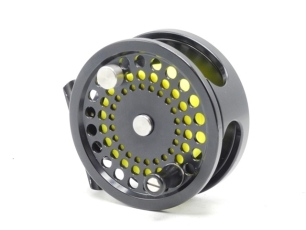 An Aaron TR78 trout fly reel and spare spool, black anodised finish, left hand wind model, counter-balanced handle, push button spool release, rear spindle mounted milled tension regulator, little used, in neoprene pouch and card box and a Loomis "GLX Dis