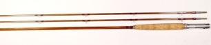 An Orvis "Battenkill" 2 piece (2 tips) cane trout fly rod, 9', 6 ¾ozs., mid-tan silk wraps, alloy screw grip reel fitting, nickel silver suction joint, no. 23501, light use only, in bag and original alloy tube